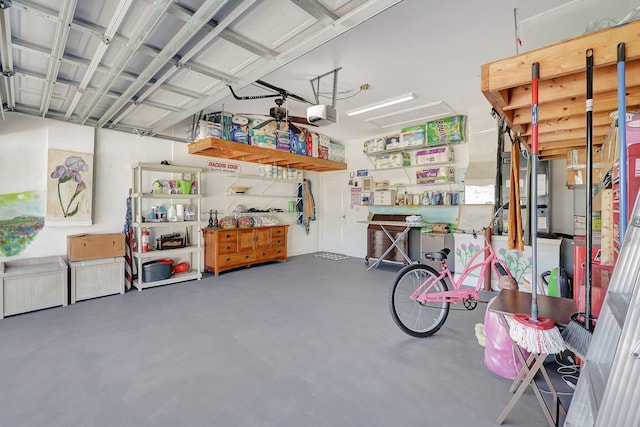 garage with a ceiling fan and a garage door opener