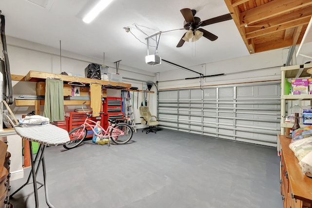 garage featuring ceiling fan and a garage door opener