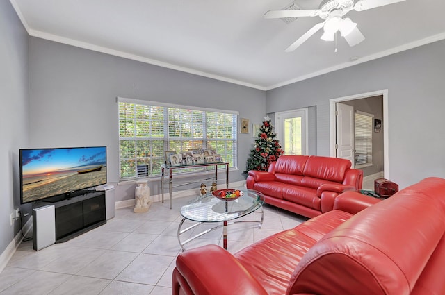 living room with light tile patterned floors, ceiling fan, and ornamental molding