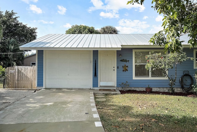 ranch-style house with a front lawn and a garage