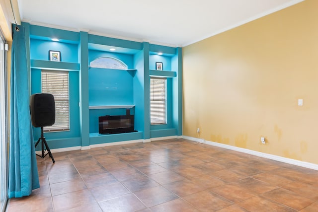 unfurnished living room featuring built in shelves, tile patterned flooring, and ornamental molding