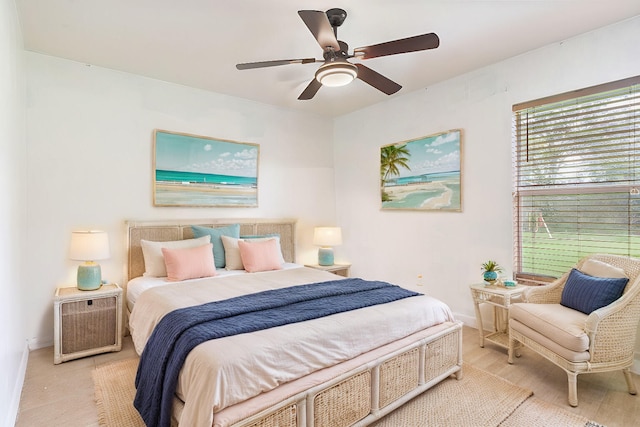 bedroom with light wood-type flooring and ceiling fan