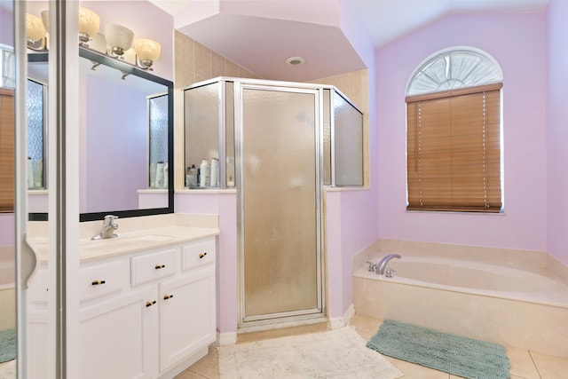 bathroom featuring tile patterned flooring, vanity, plus walk in shower, and vaulted ceiling