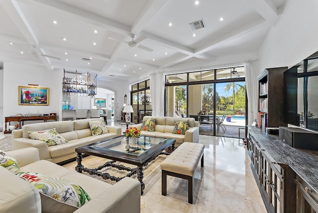 living room featuring ceiling fan, coffered ceiling, beamed ceiling, and a high ceiling