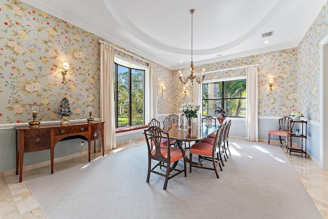 dining room featuring an inviting chandelier and ornamental molding