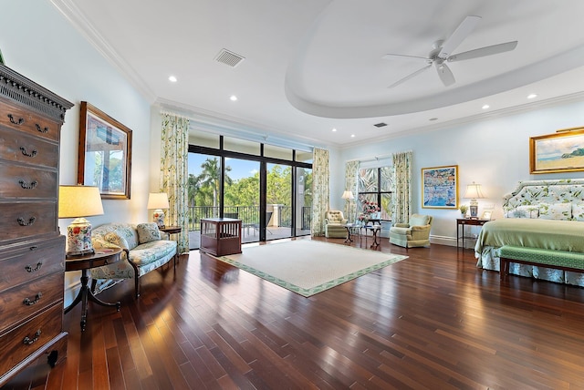 bedroom featuring access to exterior, ceiling fan, ornamental molding, dark hardwood / wood-style floors, and a tray ceiling