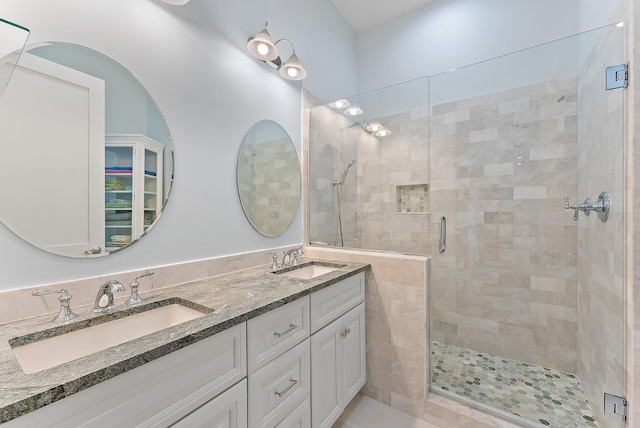 bathroom with an enclosed shower and vanity