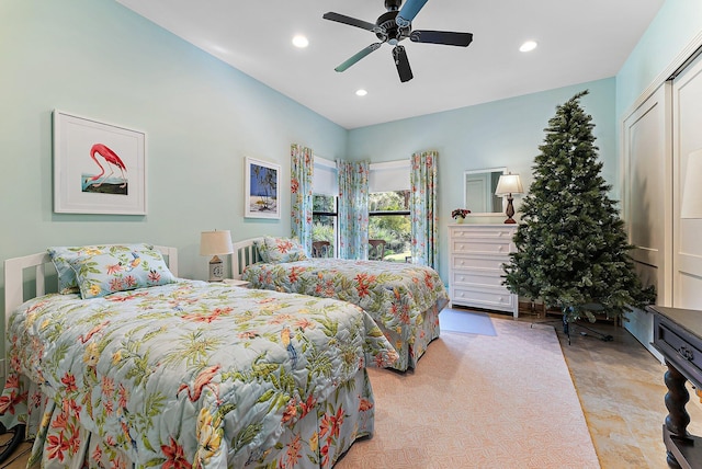 bedroom featuring ceiling fan and a closet