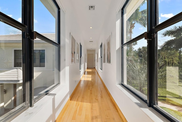 hallway with light wood-type flooring