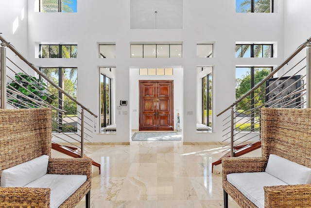 foyer featuring a towering ceiling