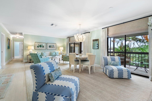 living room featuring crown molding and a notable chandelier