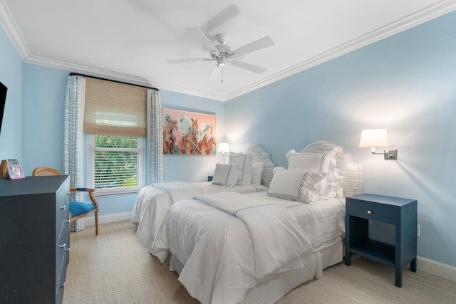 carpeted bedroom featuring ornamental molding and ceiling fan