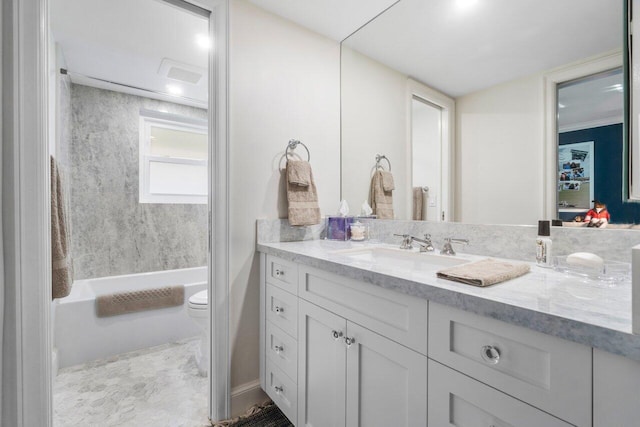 full bathroom with vanity,  shower combination, and toilet