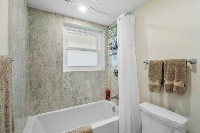 bathroom featuring shower / bathtub combination with curtain and toilet