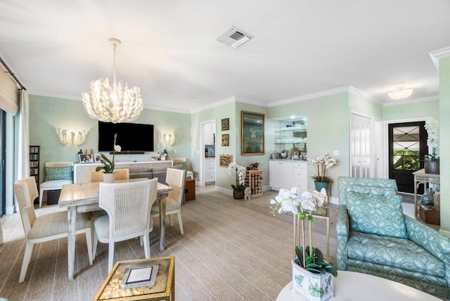 dining space featuring an inviting chandelier, light colored carpet, and ornamental molding