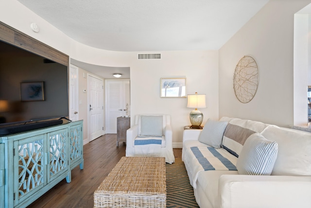 living room featuring dark hardwood / wood-style flooring