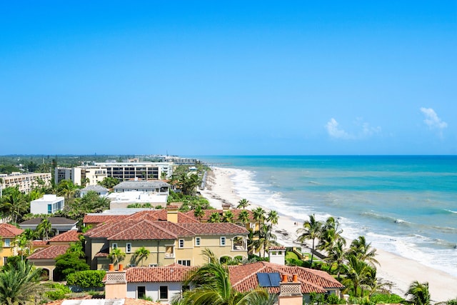 birds eye view of property featuring a view of the beach and a water view