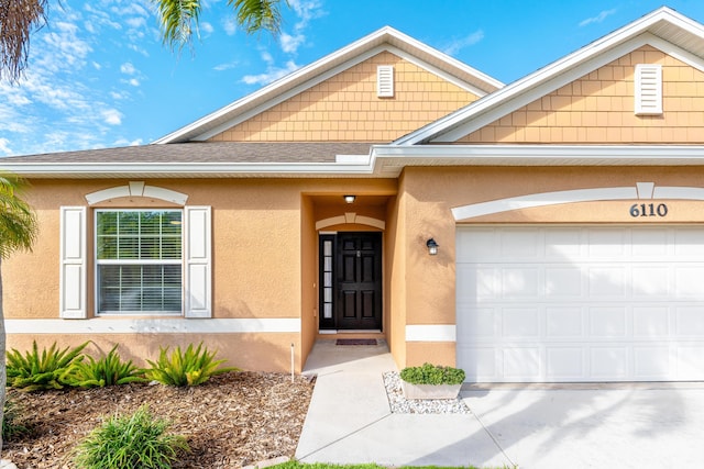 property entrance with a garage