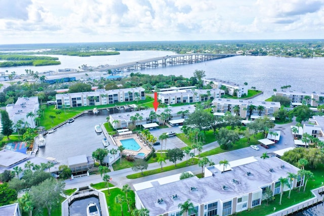 birds eye view of property featuring a water view