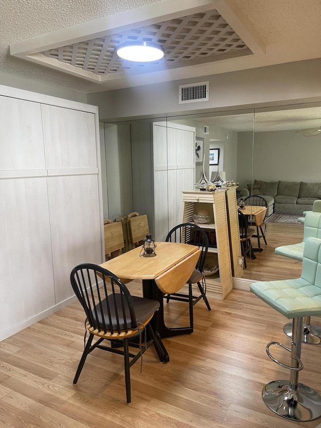 dining area with light wood-type flooring