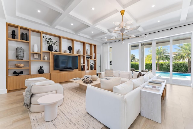 living room featuring coffered ceiling, beam ceiling, light hardwood / wood-style flooring, and an inviting chandelier