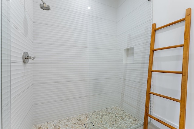 bathroom with a tile shower