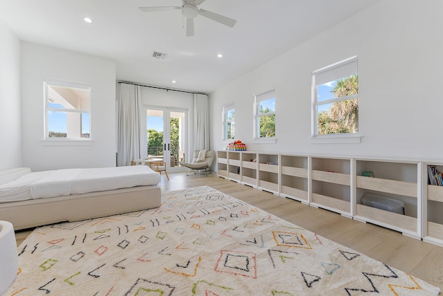 bedroom with ceiling fan and light wood-type flooring