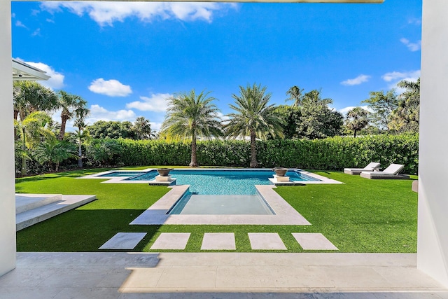 view of pool featuring a lawn