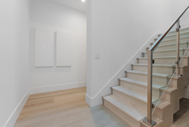 staircase featuring hardwood / wood-style flooring