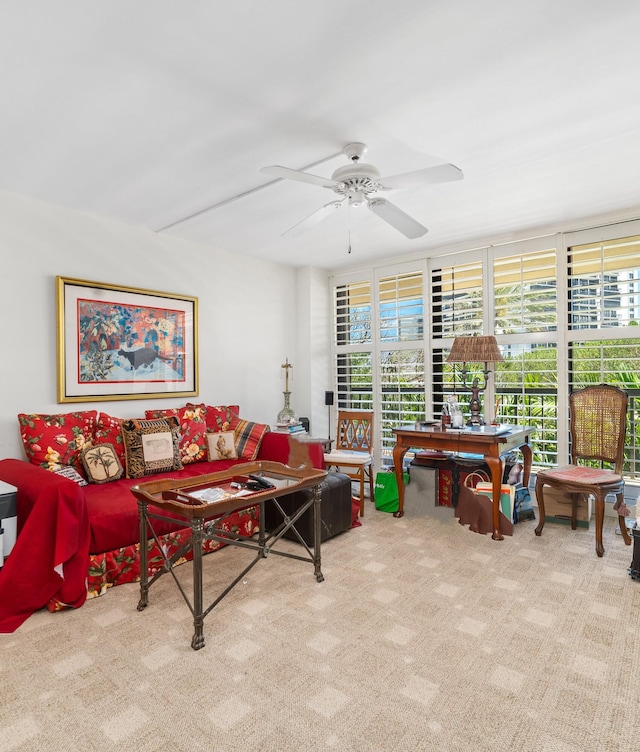 living room with ceiling fan and light colored carpet