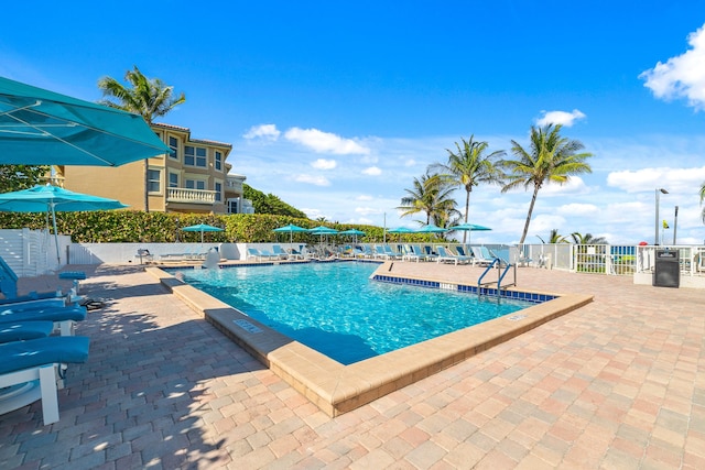 view of swimming pool with a patio area