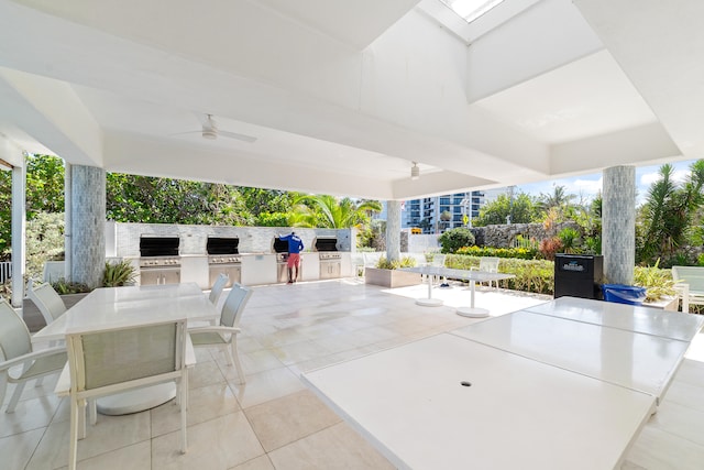 view of patio / terrace featuring area for grilling, ceiling fan, and a grill