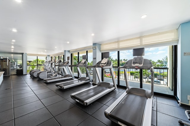 workout area featuring a wall of windows