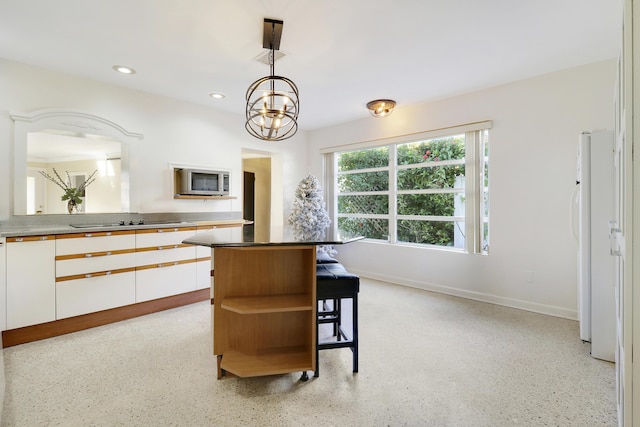 dining space with a notable chandelier