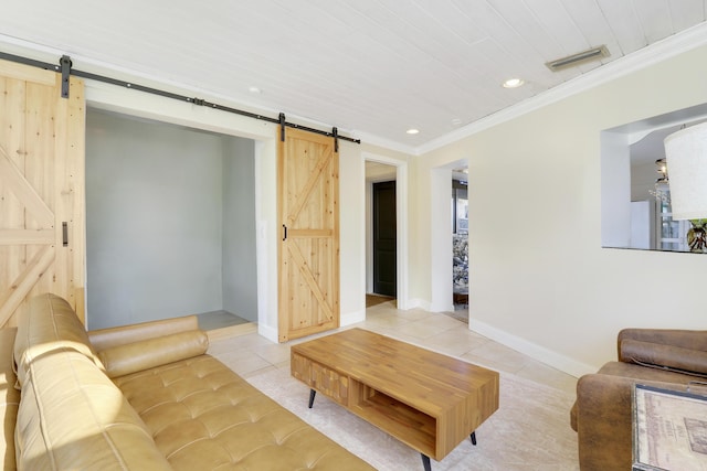 living room featuring light tile patterned floors, a barn door, and ornamental molding