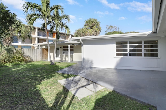 exterior space with a patio and a front yard