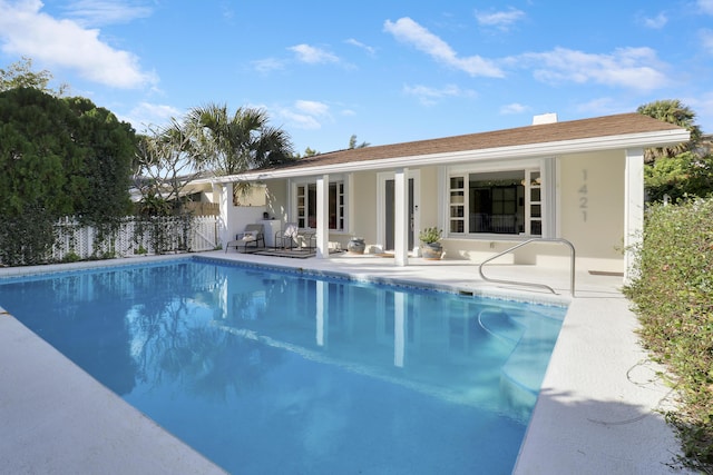 view of swimming pool featuring a patio area