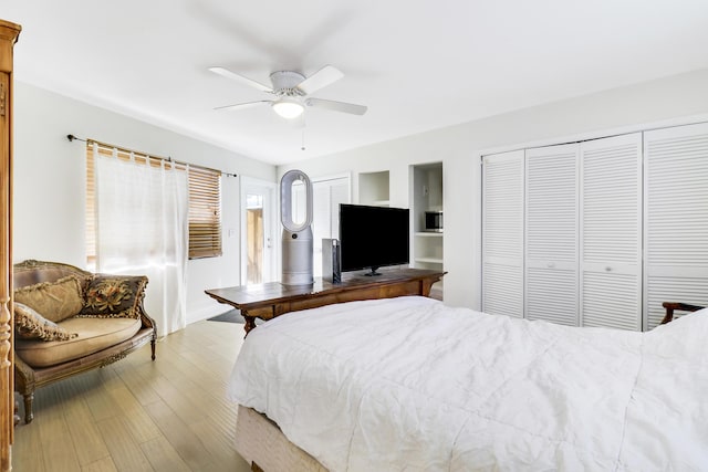 bedroom featuring ceiling fan and light wood-type flooring