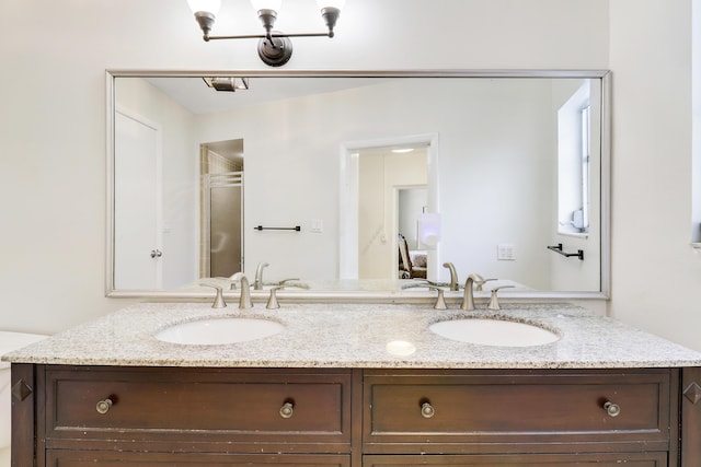 bathroom with vanity and a shower with shower door