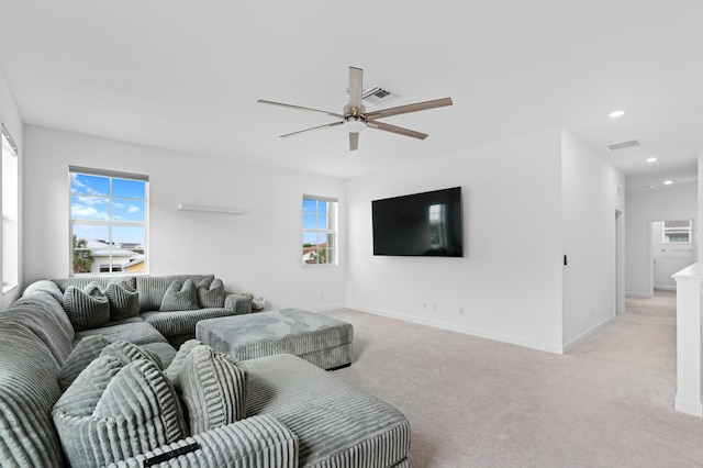 living room with ceiling fan and light carpet