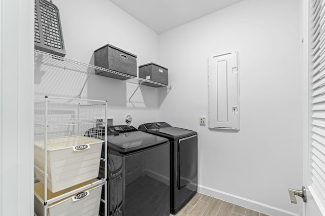 laundry room featuring washer and dryer and electric panel