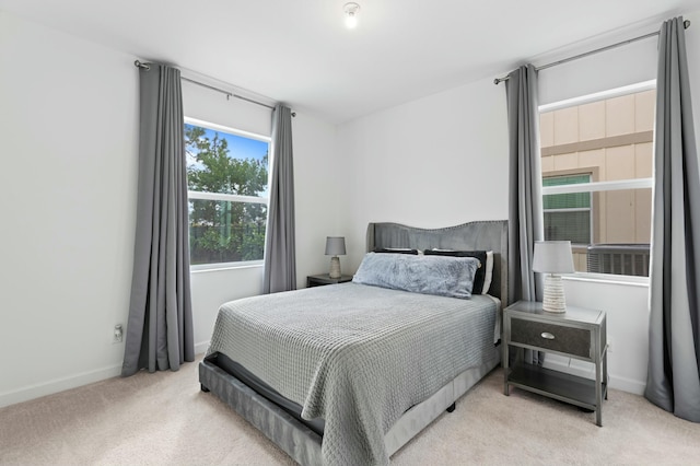 bedroom with light colored carpet