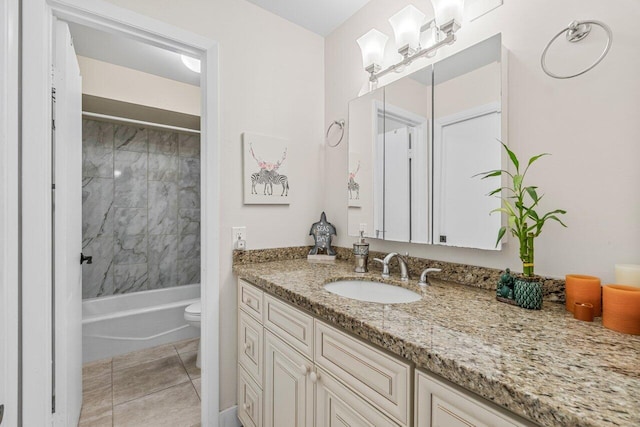 full bathroom with toilet, vanity, tile patterned floors, and tiled shower / bath