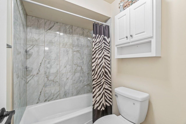 bathroom with toilet and shower / tub combo with curtain