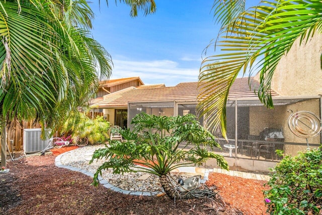 exterior space with a lanai and cooling unit