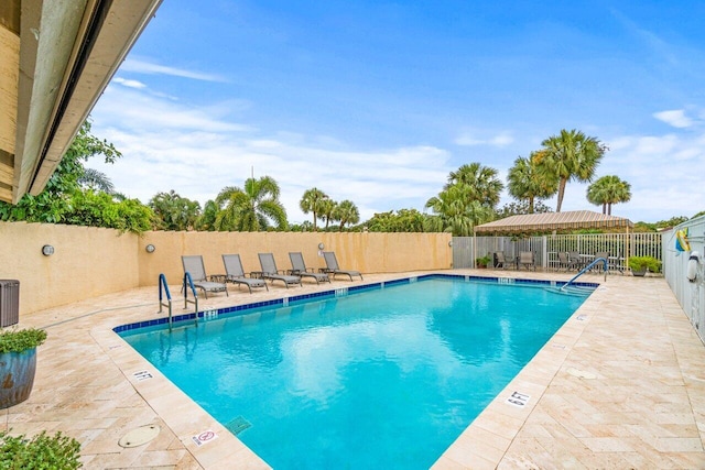 view of swimming pool featuring a patio area