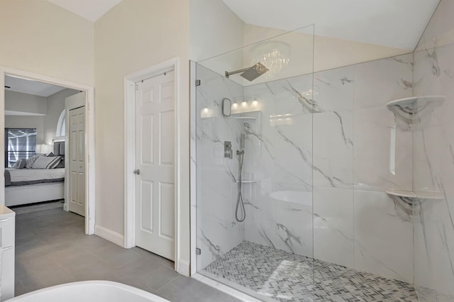 bathroom featuring separate shower and tub and vaulted ceiling