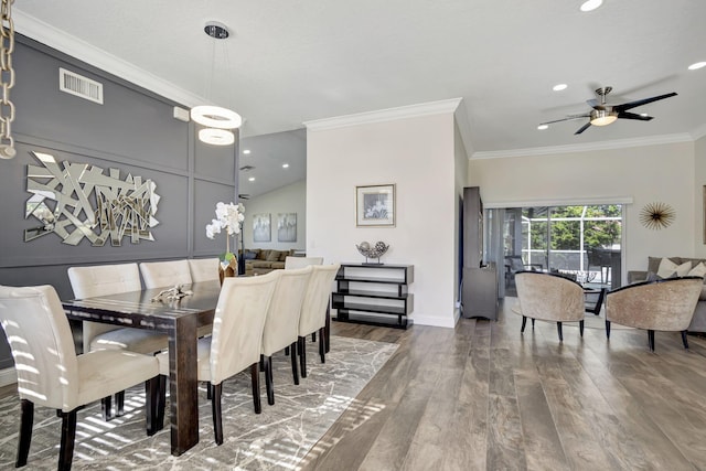 dining space featuring ceiling fan, dark hardwood / wood-style flooring, and crown molding