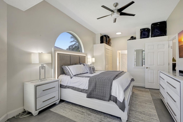 bedroom with ceiling fan, a closet, and vaulted ceiling