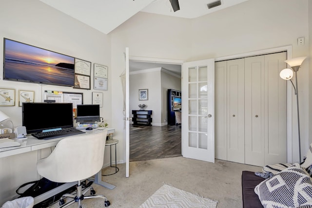 carpeted office space featuring french doors and ornamental molding